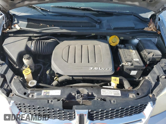 2014 Dodge Grand Caravan SXT z VIN 2C4RDGCG6ER223900, wystawiony jako Copart lot #56960965 z przebiegiem 101 275 mil mil oraz Szkoda całkowita • Salvage title. Historia ofert i sprzedaży dostępna na DreamBid. Obrazek 12.