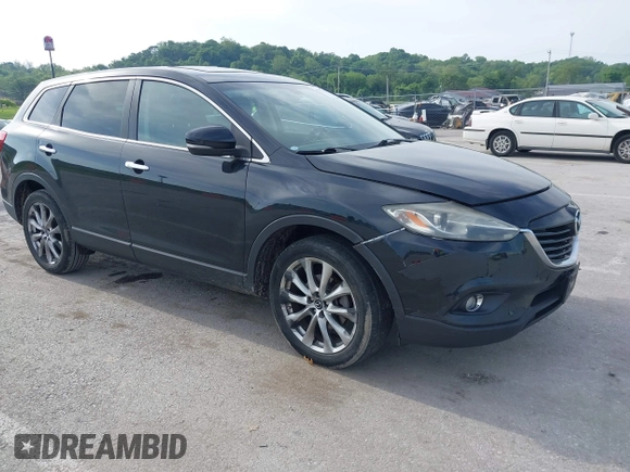 2015 Mazda CX-9 Grand Touring z VIN JM3TB2DA1F0456773, wystawiony jako IAAI lot #42257555 z przebiegiem 152 890 mil mil oraz . Historia ofert i sprzedaży dostępna na DreamBid. Obrazek 1.
