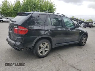 2012 BMW X5 35d with VIN 5UXZW0C54CL671377, listed as a Copart auction lot 60936395 with 105,903 mi miles and Salvage title. Bid and sale history available at DreamBid. Image 3.