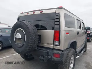 2005 Hummer H2 SUV with VIN 5GRGN23U95H129470, listed as a IAAI auction lot 42046654 with 63,489 mi miles. Bid and sale history available at carsss.com. Image 4.