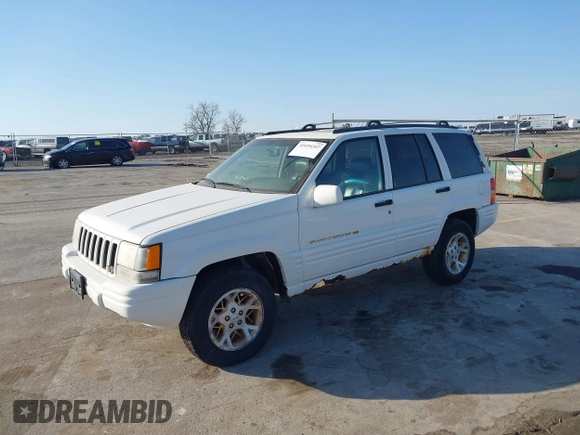 1997 Jeep Grand Cherokee Limited with VIN 1J4GZ78Y8VC769675, listed as a IAAI auction lot 41694347 with 113,834 mi miles. Bid and sale history available at carsss.com. Image 2.