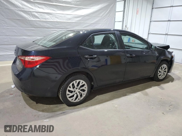 2019 Toyota Corolla L with VIN 2T1BURHE5KC185821, listed as a Copart auction lot 52613985 with 104,208 mi miles and Salvage title. Bid and sale history available at DreamBid. Image 3.