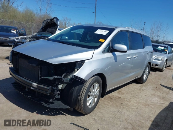 2016 Kia Sedona LX with VIN KNDMB5C12G6157582, listed as a IAAI auction lot 41932306 with 106,061 mi miles. Bid and sale history available at carsss.com. Image 2.