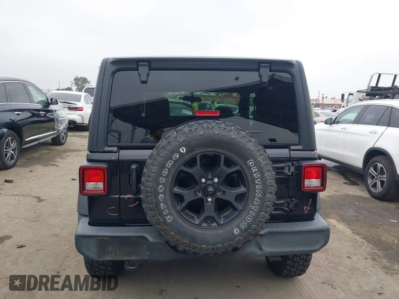 2021 Jeep Wrangler Sport with VIN 1C4GJXAN5MW627228, listed as a IAAI auction lot 42170010 with 56,965 mi miles and . Bid and sale history available at DreamBid. Image 16.