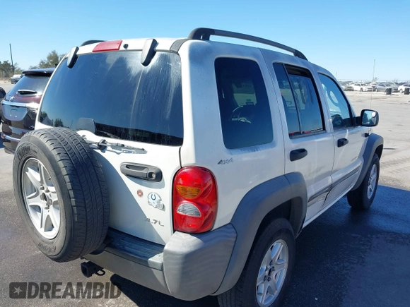 2002 Jeep Liberty Sport with VIN 1J8GL48KX2W153948, listed as a IAAI auction lot 41843882 with 180,677 mi miles. Bid and sale history available at carsss.com. Image 4.