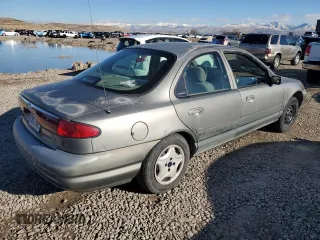 1998 Ford Contour z VIN 1FAFP66Z5WK232756, wystawiony jako Copart lot #86648364 z przebiegiem 118 176 mil mil oraz Tytuł czysty. Historia ofert i sprzedaży dostępna na DreamBid. Obrazek 3.