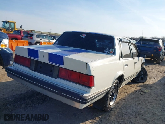 1988 Chevrolet Celebrity z VIN 1G1AW51W4J6137291, wystawiony jako IAAI lot #41777521 z przebiegiem 163 299 mil mil oraz . Historia ofert i sprzedaży dostępna na DreamBid. Obrazek 4.