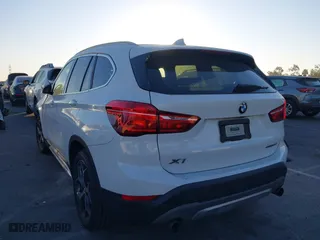 2019 BMW X1 sDrive28i with VIN WBXHU7C54K3H45462, listed as a IAAI auction lot 41209117 with 52,719 mi miles. Bid and sale history available at carsss.com. Image 3.