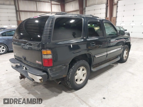 2005 GMC Yukon SLT with VIN 1GKEK13T15J143363, listed as a IAAI auction lot 41996424 with 272,819 mi miles. Bid and sale history available at carsss.com. Image 4.