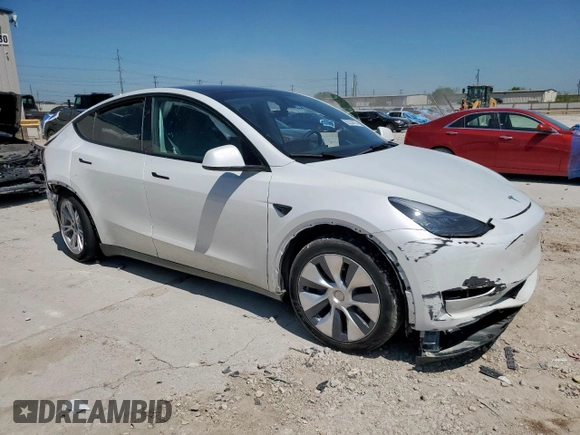 2023 Tesla Model Y Long Range z VIN 7SAYGDEE1PA155629, wystawiony jako Copart lot #52234735 z przebiegiem 24 944 mil mil oraz Szkoda całkowita • Salvage title. Historia ofert i sprzedaży dostępna na DreamBid. Obrazek 4.