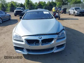 2013 BMW 6 Series 650i z VIN WBAYM9C57DDW20410, wystawiony jako IAAI lot #42348010 z przebiegiem 146 985 mil mil oraz . Historia ofert i sprzedaży dostępna na DreamBid. Obrazek 12.