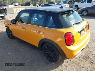 2015 MINI Hardtop 4 Door S z VIN WMWXU3C51F2B57061, wystawiony jako IAAI lot #41691431 z przebiegiem 66 406 mil mil oraz . Historia ofert i sprzedaży dostępna na DreamBid. Obrazek 3.
