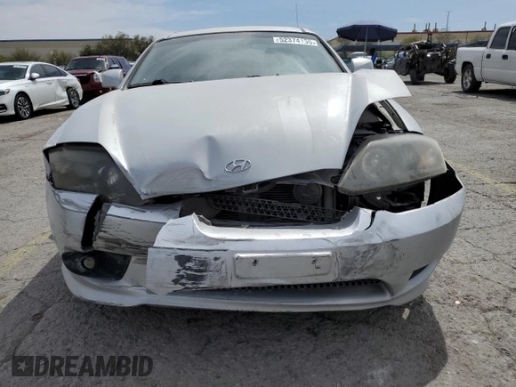 2006 Hyundai Tiburon GT z VIN KMHHN65F06U203701, wystawiony jako Copart lot #52374135 z przebiegiem 90 796 mil mil oraz Szkody całkowita. Historia ofert i sprzedaży dostępna na DreamBid. Obrazek 5.