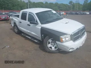 2005 Dodge Dakota SLT with VIN 1D7HW48N45S153653, listed as a IAAI auction lot 42295111 with 101,738 mi miles and . Bid and sale history available at DreamBid. Image 1.