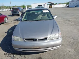 1998 Toyota Corolla VE z VIN 2T1BR18E9WC045442, wystawiony jako IAAI lot #42104201 z przebiegiem 243 256 mil mil oraz . Historia ofert i sprzedaży dostępna na DreamBid. Obrazek 12.