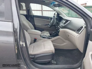 2017 Hyundai Tucson SE with VIN KM8J23A45HU593761, listed as a IAAI auction lot 41885334 with 198,658 mi miles. Bid and sale history available at carsss.com. Image 5.