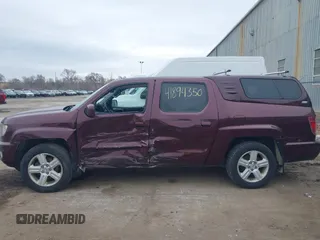 2011 Honda Ridgeline RTL with VIN 5FPYK1F51BB007959, listed as a IAAI auction lot 41894350 with 186,926 mi miles. Bid and sale history available at carsss.com. Image 14.