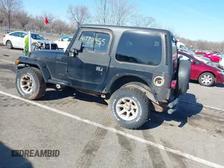 1997 Jeep Wrangler SE with VIN 1J4FY29P6VP438125, listed as a IAAI auction lot 41770455 with 163,001 mi miles. Bid and sale history available at carsss.com. Image 3.