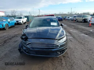 2018 Ford Fusion SE z VIN 3FA6P0HD7JR259606, wystawiony jako IAAI lot #41649797 z przebiegiem 94 094 mil mil oraz . Historia ofert i sprzedaży dostępna na DreamBid. Obrazek 12.