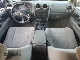 2006 GMC Envoy SLE with VIN 1GKET16S166171992, listed as a Copart auction lot 76676894 with 203,713 mi miles and Salvage Title. Bid and sale history available at DreamBid. Image 8.