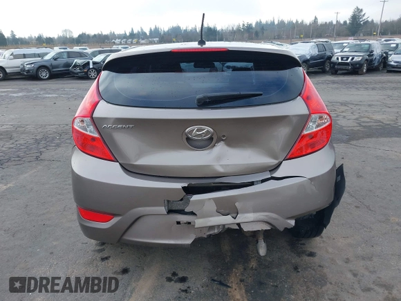 2013 Hyundai Accent SE z VIN KMHCU5AE1DU079830, wystawiony jako IAAI lot #41529695 z przebiegiem 105 637 mil mil oraz . Historia ofert i sprzedaży dostępna na DreamBid. Obrazek 16.