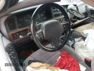 1996 Jeep Grand Cherokee Laredo with VIN 1J4GZ58S2TC401845, listed as a Copart auction lot 61013044 with 0 mi miles and Salvage Title. Bid and sale history available at carsss.com. Image 8.