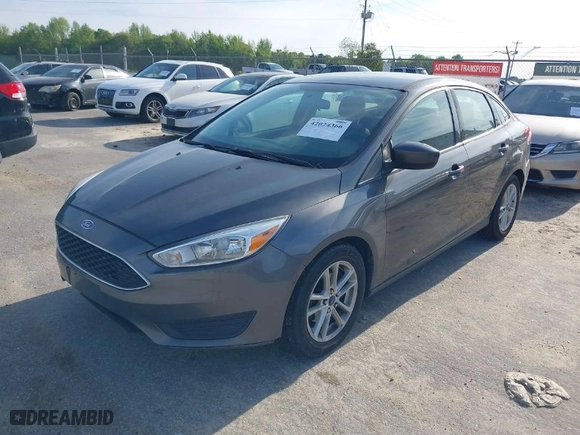 2018 Ford Focus SE with VIN 1FADP3F24JL207231, listed as a IAAI auction lot 42024366 with 134,446 mi miles. Bid and sale history available at carsss.com. Image 2.