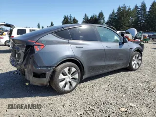 2020 Tesla Model Y Long Range with VIN 5YJYGDEEXLF017789, listed as a Copart auction lot 52705185 with 49,470 mi miles and Salvage Title. Bid and sale history available at DreamBid. Image 3.