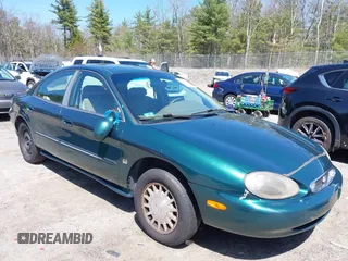 1999 Mercury Sable LS Premium Group z VIN 1MEFM53S6XA618080, wystawiony jako IAAI lot #42079814 z przebiegiem 117 579 mil mil oraz . Historia ofert i sprzedaży dostępna na DreamBid. Obrazek 1.
