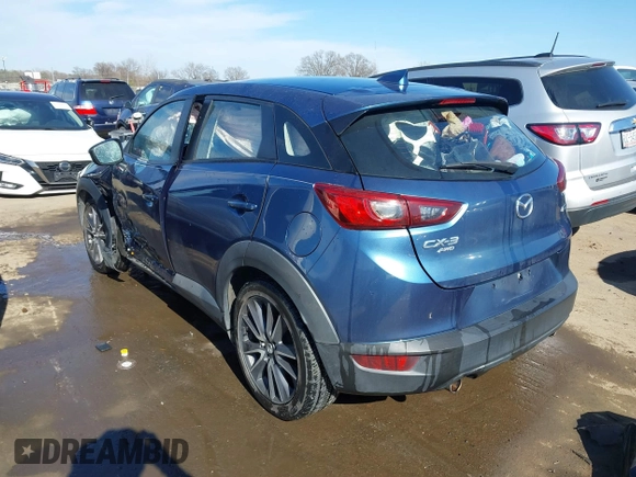 2018 Mazda CX-3 Touring z VIN JM1DKFC73J0301449, wystawiony jako IAAI lot #41678604 z przebiegiem 105 249 mil mil oraz . Historia ofert i sprzedaży dostępna na DreamBid. Obrazek 3.