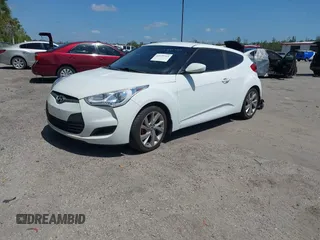 2016 Hyundai Veloster with VIN KMHTC6AD3GU270895, listed as a IAAI auction lot 42139765 with 138,884 mi miles. Bid and sale history available at carsss.com. Image 2.