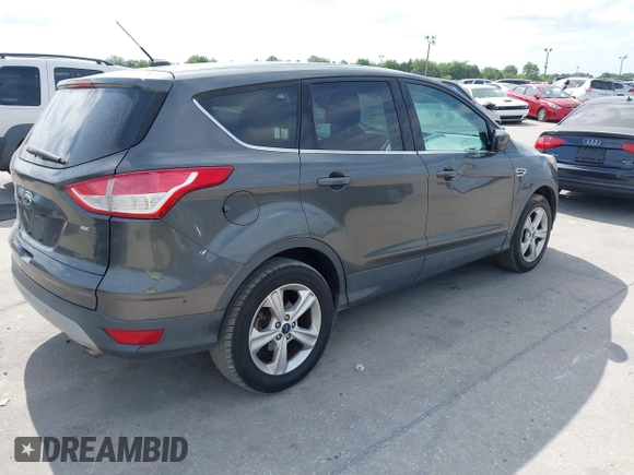 2015 Ford Escape SE with VIN 1FMCU0G7XFUA89965, listed as a IAAI auction lot 42072553 with 129,877 mi miles. Bid and sale history available at carsss.com. Image 4.