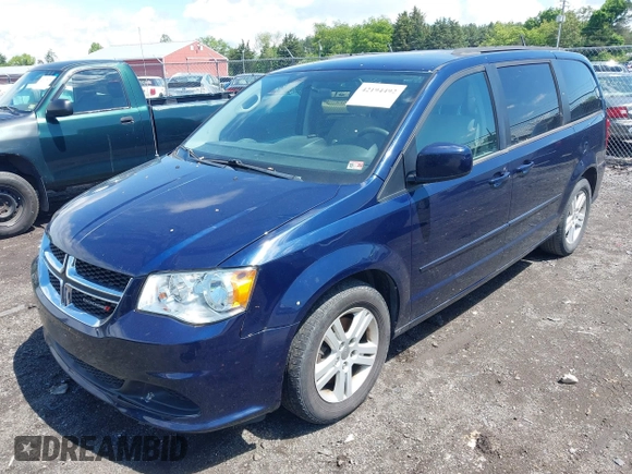 2012 Dodge Grand Caravan SXT with VIN 2C4RDGCGXCR277505, listed as a IAAI auction lot 42194492 with 206,565 mi miles and . Bid and sale history available at DreamBid. Image 2.