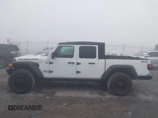 2022 Jeep Gladiator Rubicon z VIN 1C6JJTBG3NL111054, wystawiony jako IAAI lot #40793144 z przebiegiem 40 115 mil mil oraz . Historia ofert i sprzedaży dostępna na DreamBid. Obrazek 15.