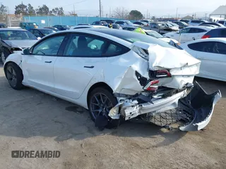 2022 Tesla Model 3 with VIN 5YJ3E1EA1NF167711, listed as a IAAI auction lot 41594266 with 50,554 mi miles and . Bid and sale history available at DreamBid. Image 3.