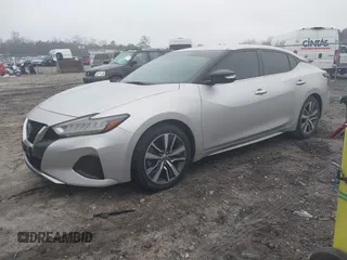 2019 Nissan Maxima Platinum z VIN 1N4AA6AV6KC372254, wystawiony jako IAAI lot #41519515 z przebiegiem 124 326 mil mil oraz . Historia ofert i sprzedaży dostępna na DreamBid. Obrazek 2.