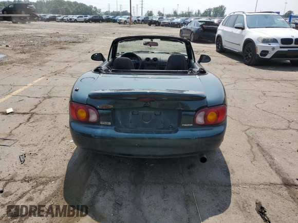 2000 Mazda MX-5 Miata with VIN JM1NB3533Y0151883, listed as a Copart auction lot 64423925 with 180,275 mi miles and Salvage title. Bid and sale history available at DreamBid. Image 6.