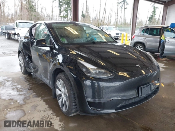2023 Tesla Model Y Long Range with VIN 7SAYGAEE7PF739924, listed as a IAAI auction lot 41612323 with 75,226 mi miles and . Bid and sale history available at DreamBid. Image 1.