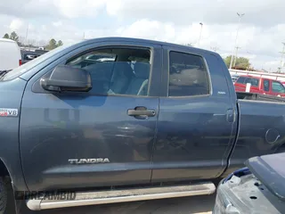 2010 Toyota Tundra z VIN 5TFUW5F13AX138105, wystawiony jako IAAI lot #41499018 z przebiegiem 295 414 mil mil oraz . Historia ofert i sprzedaży dostępna na DreamBid. Obrazek 15.