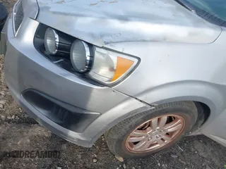 2013 Chevrolet Sonic LT with VIN 1G1JC5SH1D4205197, listed as a IAAI auction lot 41623803 with 153,666 mi miles and . Bid and sale history available at DreamBid. Image 13.