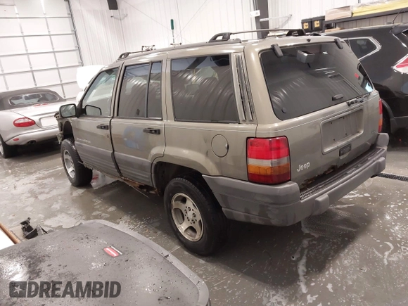 1997 Jeep Grand Cherokee Laredo with VIN 1J4GZ58S2VC746778, listed as a IAAI auction lot 41225925 with 196,679 mi miles. Bid and sale history available at carsss.com. Image 3.
