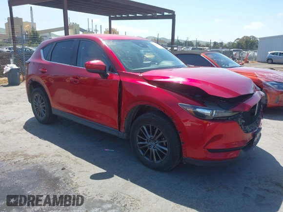 2019 Mazda CX-5 Touring with VIN JM3KFACM5K1516242, listed as a IAAI auction lot 42019803 with 113,953 mi miles. Bid and sale history available at carsss.com. Image 1.