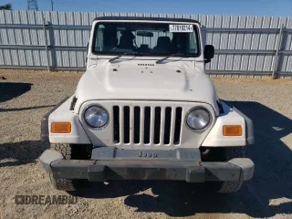 2006 Jeep Wrangler Sport Right Hand Drive with VIN 1J4F449S76P747454, listed as a Copart auction lot 77819214 with 184,763 mi miles and Salvage Title. Bid and sale history available at carsss.com. Image 5.