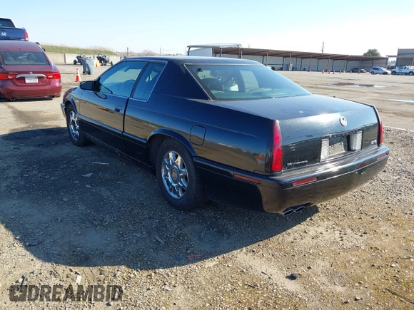 2001 Cadillac Eldorado Touring ETC z VIN 1G6ET12961B100627, wystawiony jako IAAI lot #41458966 z przebiegiem 113 620 mil mil oraz . Historia ofert i sprzedaży dostępna na DreamBid. Obrazek 3.