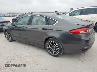 2017 Ford Fusion Hybrid Titanium with VIN 3FA6P0RU7HR388521, listed as a Copart auction lot 57318895 with 117,720 mi miles and Salvage title. Bid and sale history available at DreamBid. Image 2.