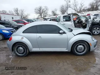 2012 Volkswagen Beetle 2.5L PZEV with VIN 3VWJP7ATXCM601206, listed as a IAAI auction lot 41733311 with 111,742 mi miles. Bid and sale history available at carsss.com. Image 13.