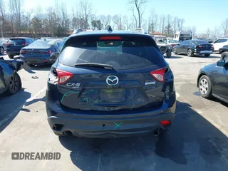 2016 Mazda CX-5 Touring with VIN JM3KE4CY0G0631786, listed as a IAAI auction lot 41761214 with 220,058 mi miles. Bid and sale history available at carsss.com. Image 16.