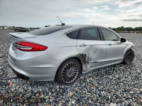2018 Ford Fusion Titanium with VIN 3FA6P0D91JR207051, listed as a Copart auction lot 59539135 with 204,017 mi miles and Salvage title. Bid and sale history available at DreamBid. Image 3.