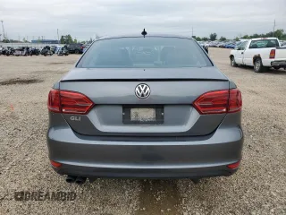 2014 Volkswagen Jetta GLI z VIN 3VW4T7AJ2EM245201, wystawiony jako Copart lot #64901935 z przebiegiem 147 799 mil mil oraz Czysty tytuł • Clean title. Historia ofert i sprzedaży dostępna na DreamBid. Obrazek 6.