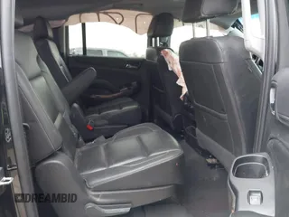 2019 Chevrolet Suburban Premier with VIN 1GNSKJKC7KR261826, listed as a IAAI auction lot 41652451 with 127,032 mi miles and . Bid and sale history available at DreamBid. Image 8.